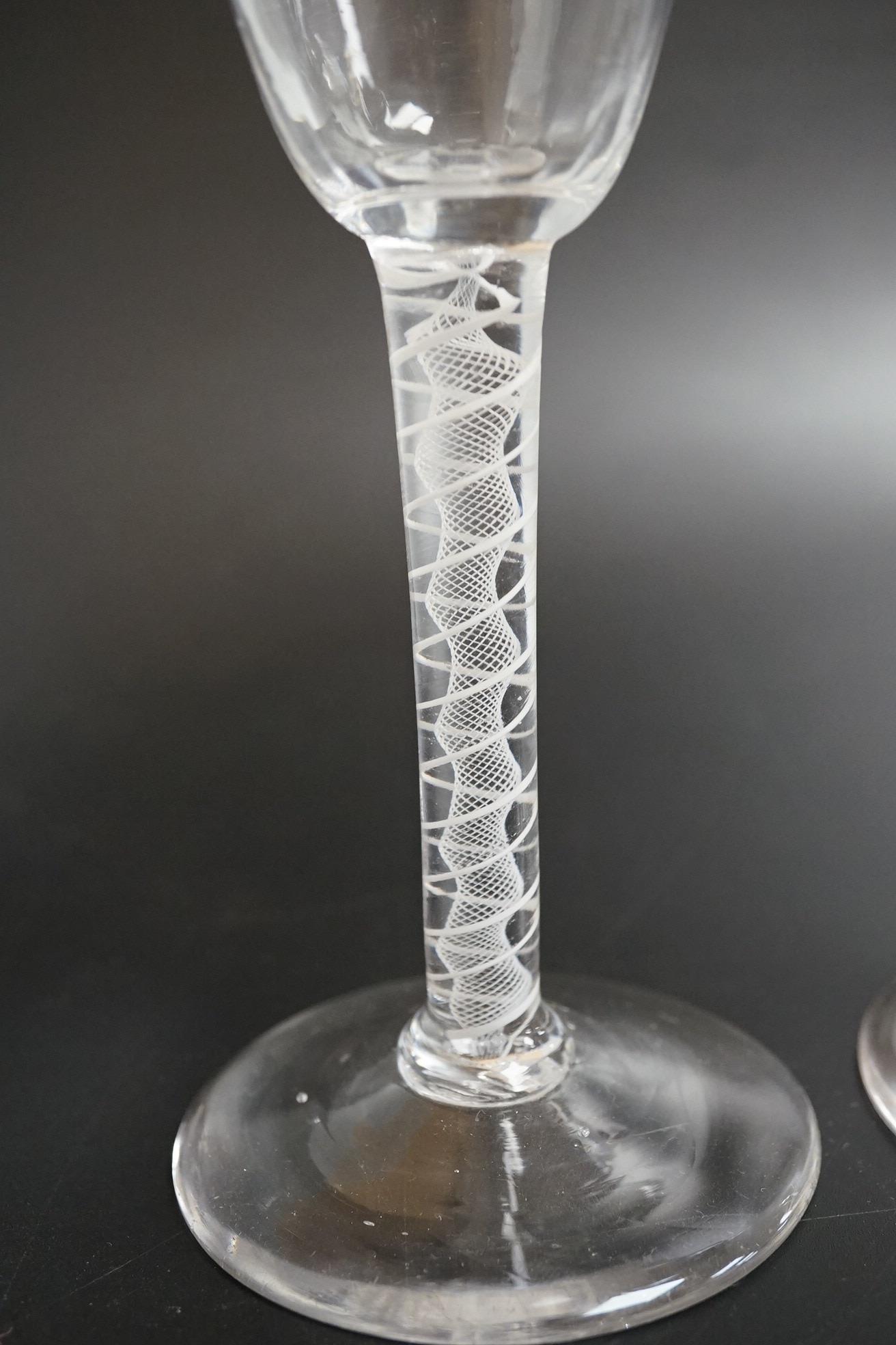 A near pair of opaque twist wine glasses, c.1760, 17.3cm high